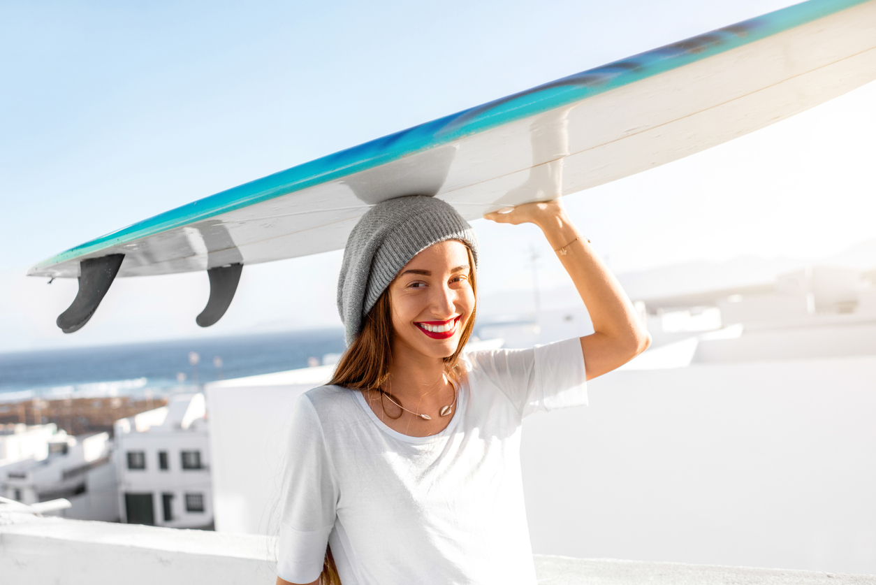 Woman with surfboard