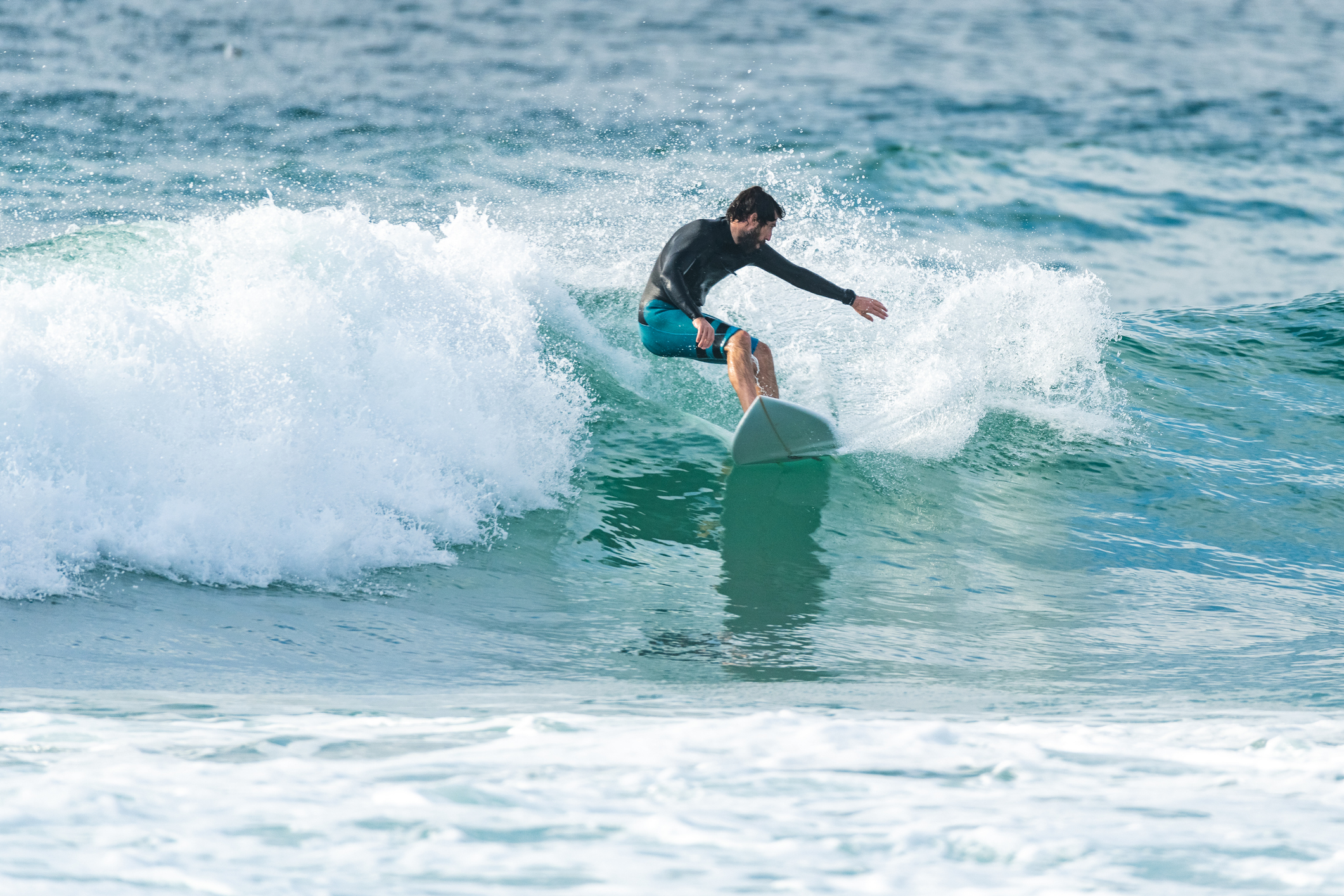 Local Surfer Riding Waves in Algarve