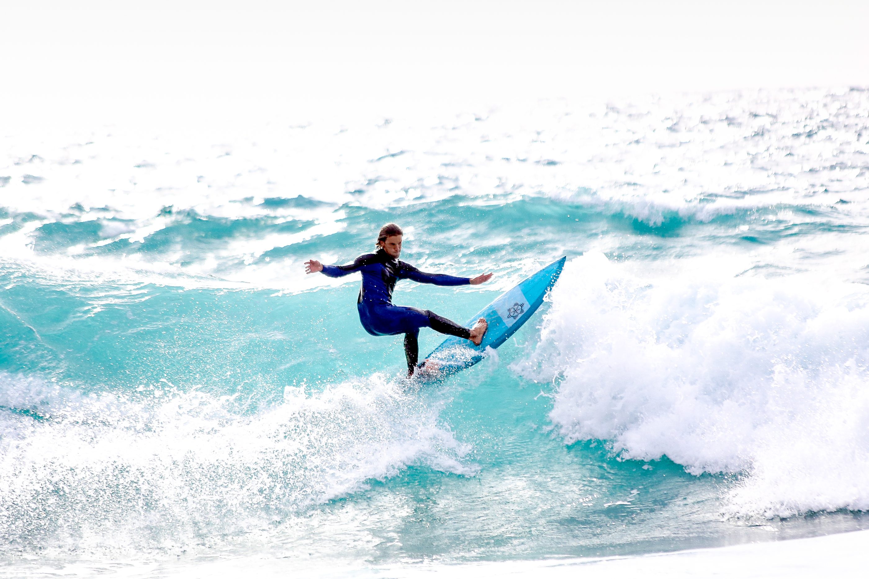 Surfing at Odeceixe beach in the Algarve