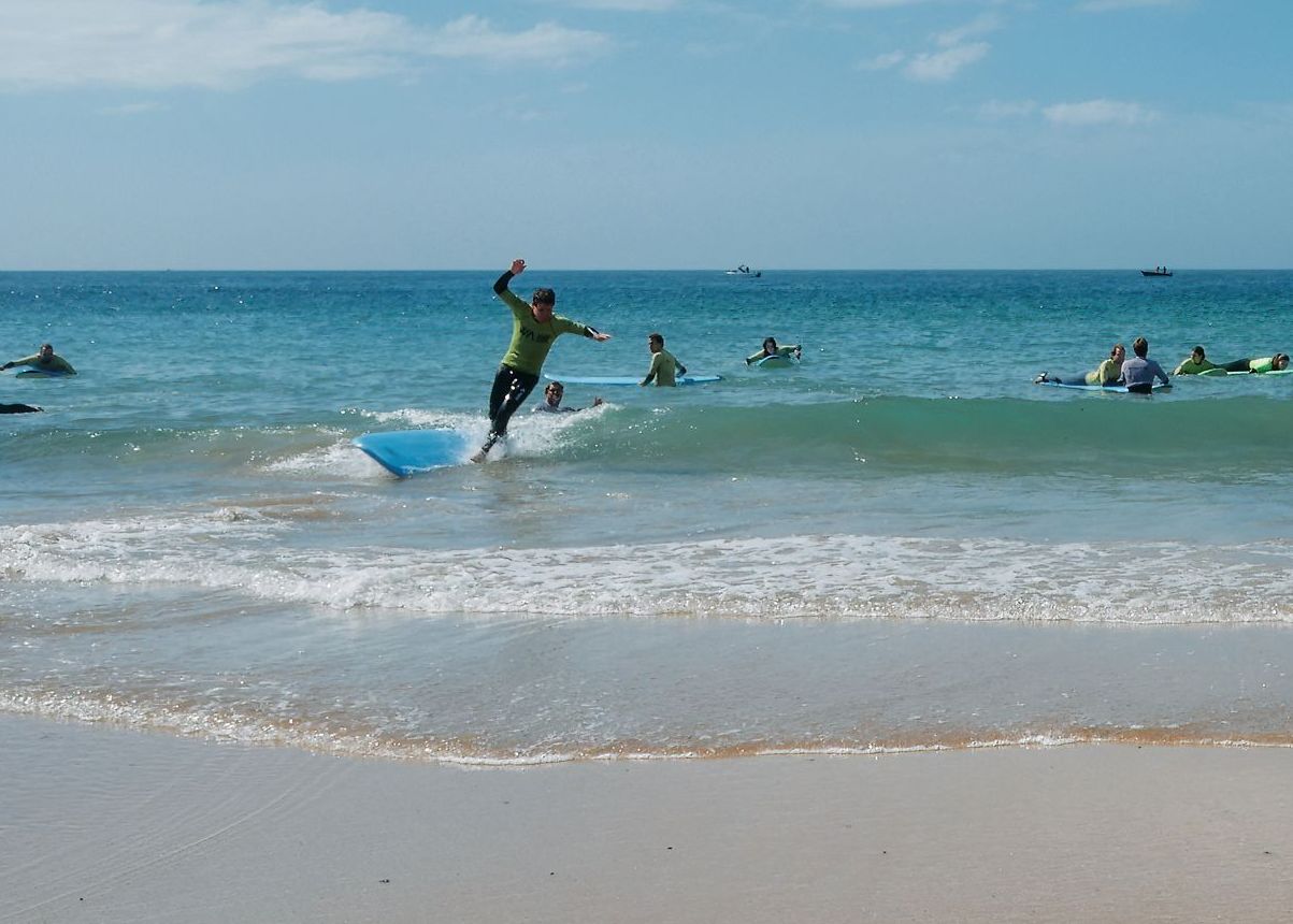 Standing-up-for-first-time-surfing-in-Carcavelos